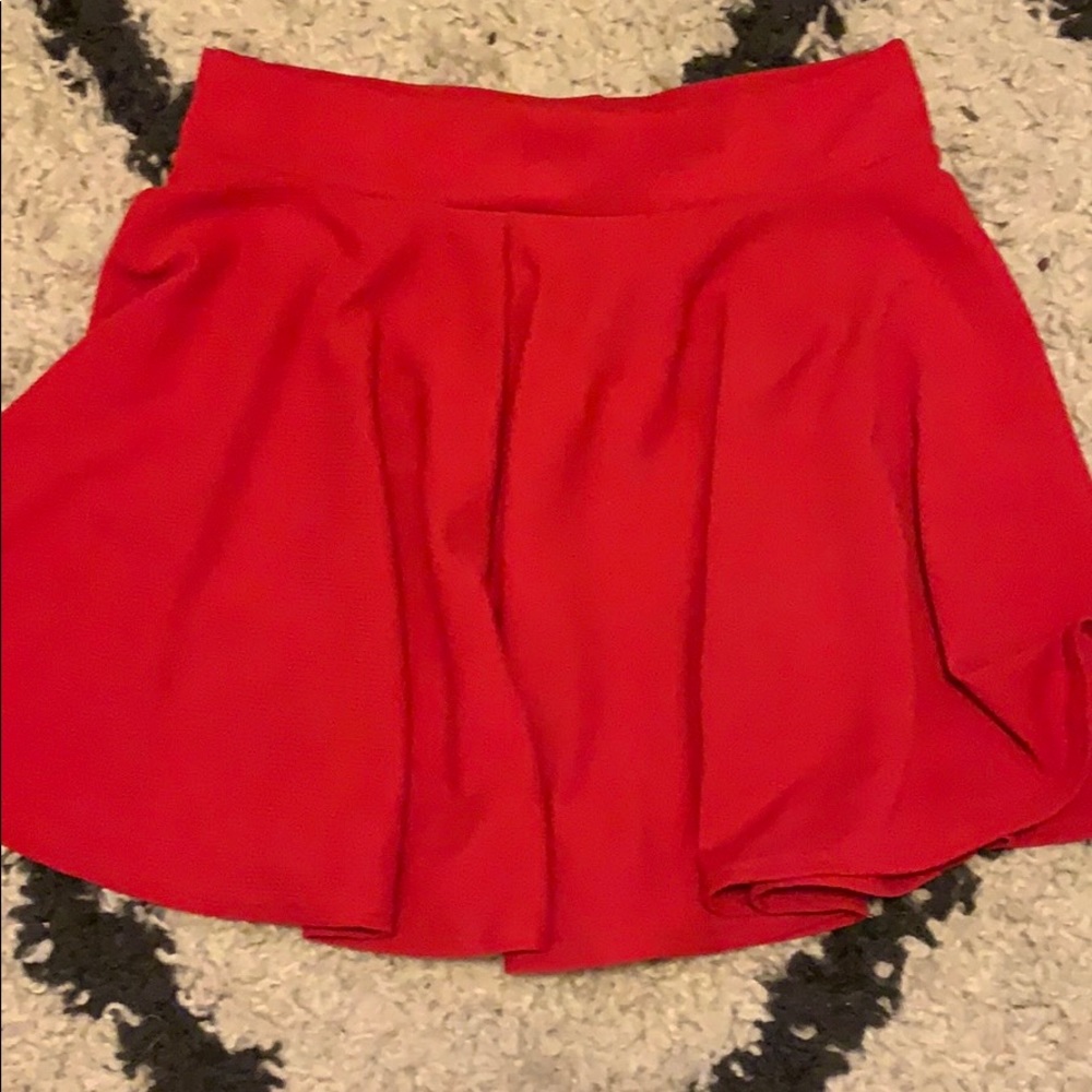 Red pleaded skirt